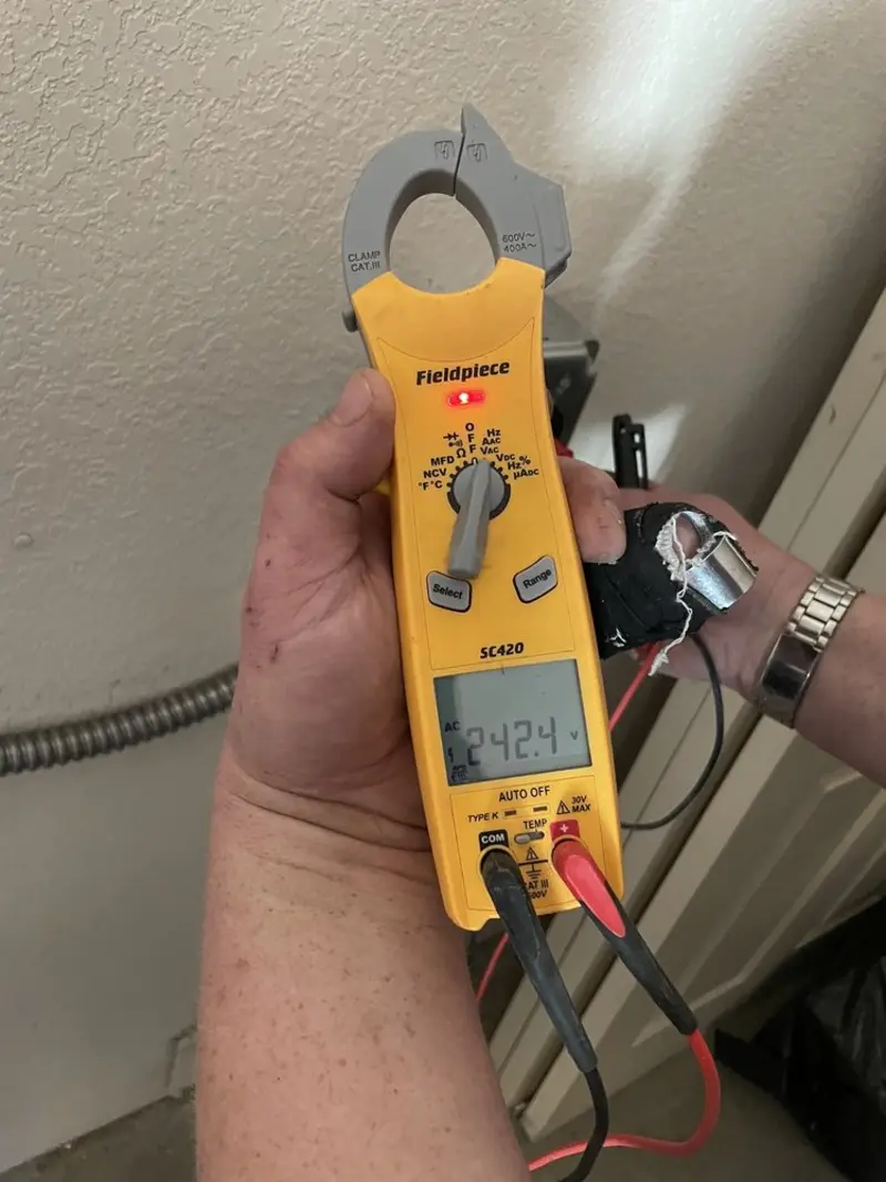 Voltage testing with clamp meter during Recessed Lighting Installation in Peachtree Corners